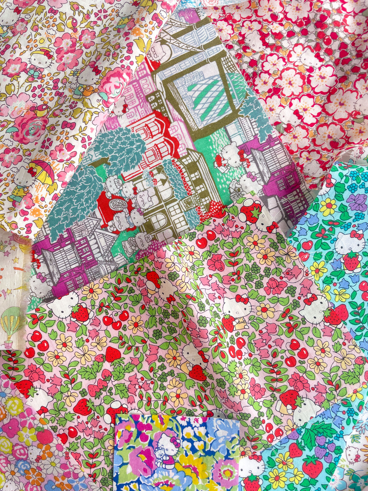 Curated scrap bags containing an assortment of adorable Hello Kitty x Liberty Japan Tana Lawn pieces, ranging in sizes from 6-25cm in diameter (2.5"-10").