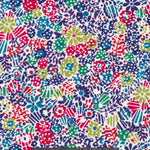 Clarricoates, from Liberty's 2012 seasonal collection, has a bold all-over mix of graphic floral motifs in navy, red, and chartreuse green.