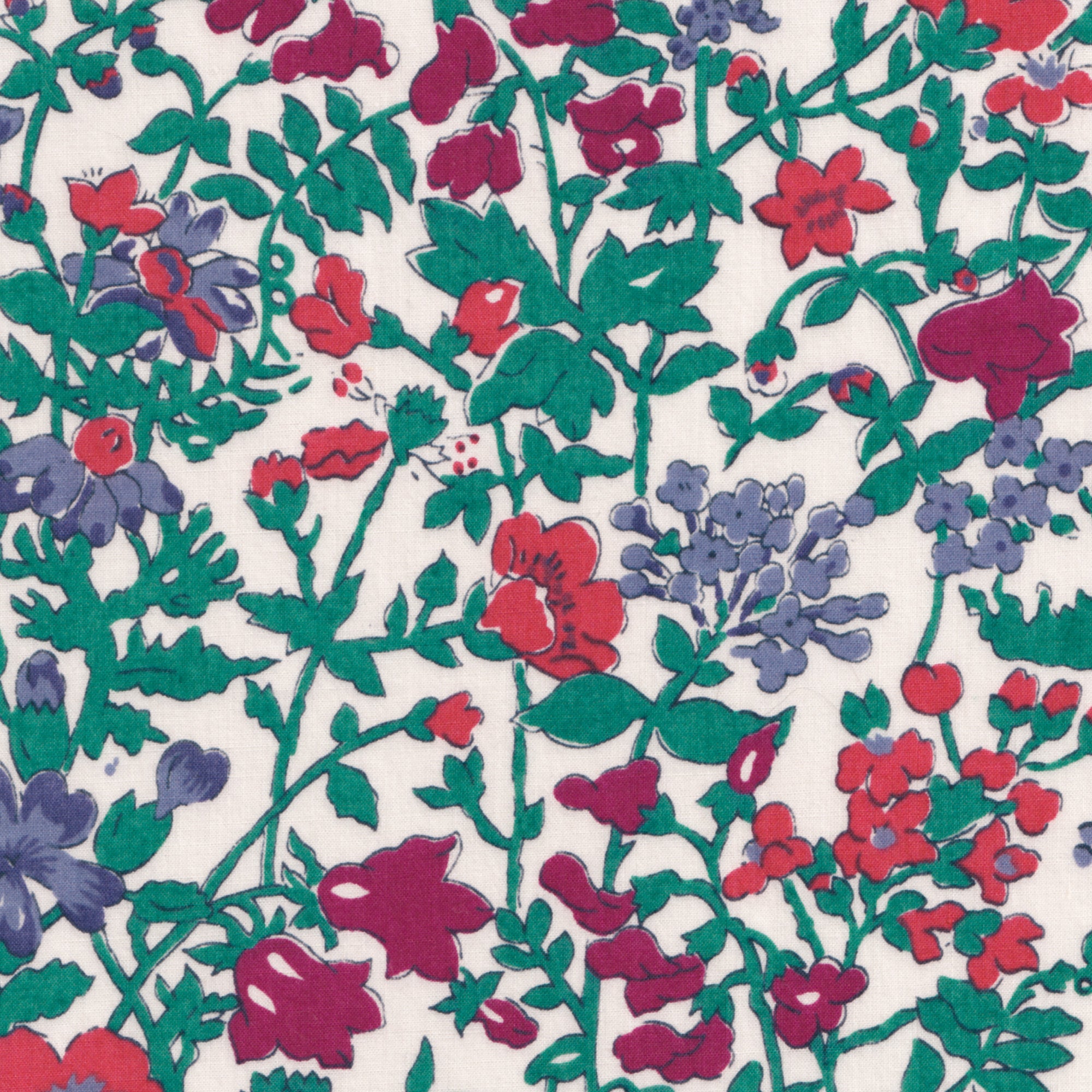 A rare vintage Clover floral Liberty print from the 1980s, with a sweet wildflower print in shades of blue, red, and deep green on a warm white background.