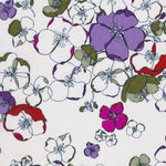 Glynis is a rare graphic Liberty floral from the early 2000s, with hand-drawn flowers in purple, red, fuchsia, and sage green on a white background.