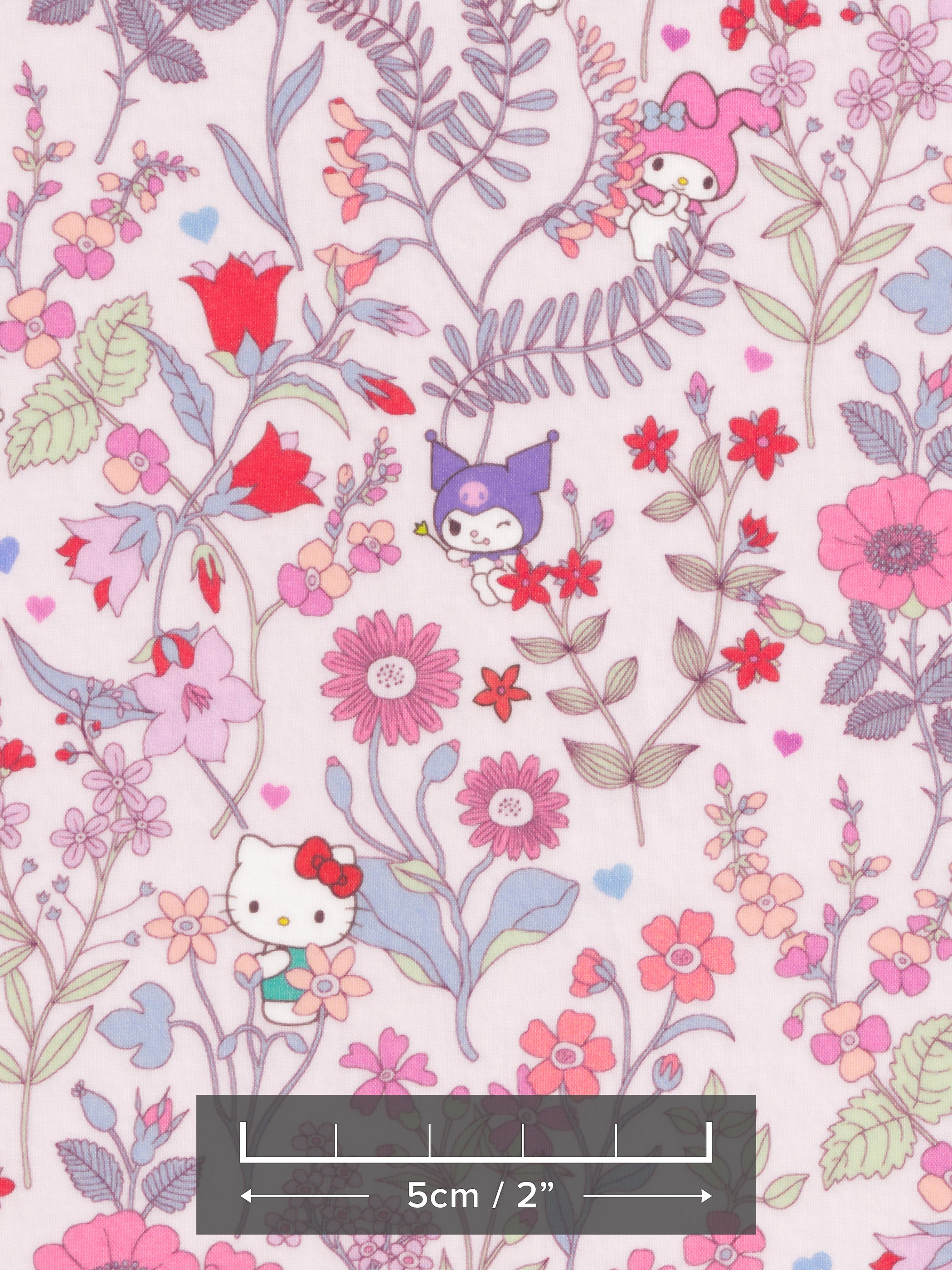 A seriously gorgeous print from the newest Liberty Japan x Sanrio collaboration. Hello Kitty, Kuromi and friends dance on a soft, dreamy version of the Lola Weisselberg print, with pink and red wildflowers, lilac ferns and scattered hearts on a blush pink background.