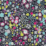 Kayoko is a dense floral pattern inspired by a design in a 1920s pattern book in the Liberty Fabrics archive. This discontinued colourway has pops of blue, acid green, pink, and purple on a black background.