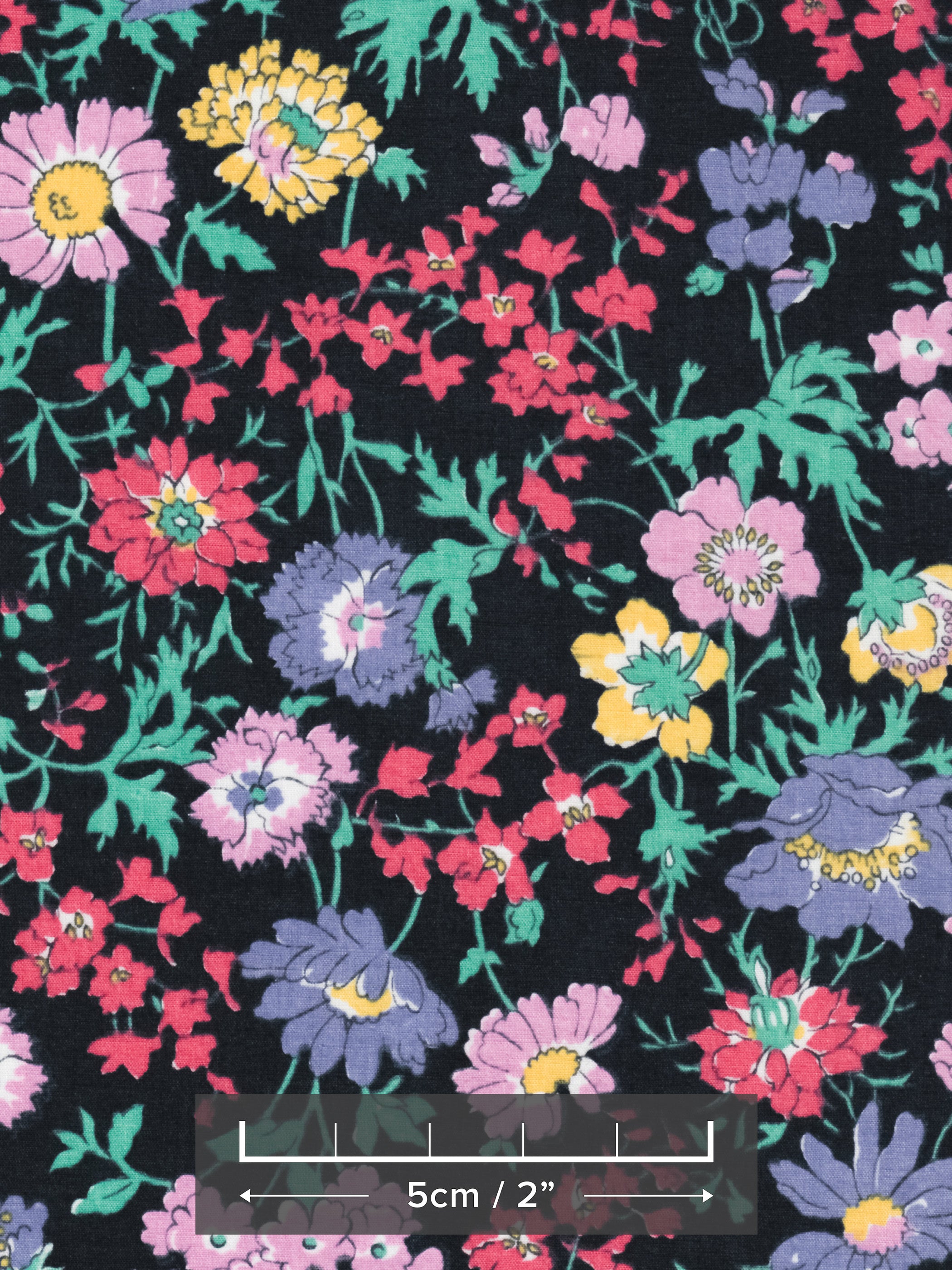 Channel the electric colours of the 1980s with this original Liberty Pyretheum Daisy print. Red, purple, blue, green, and yellow flowers pop against a blackground. 
