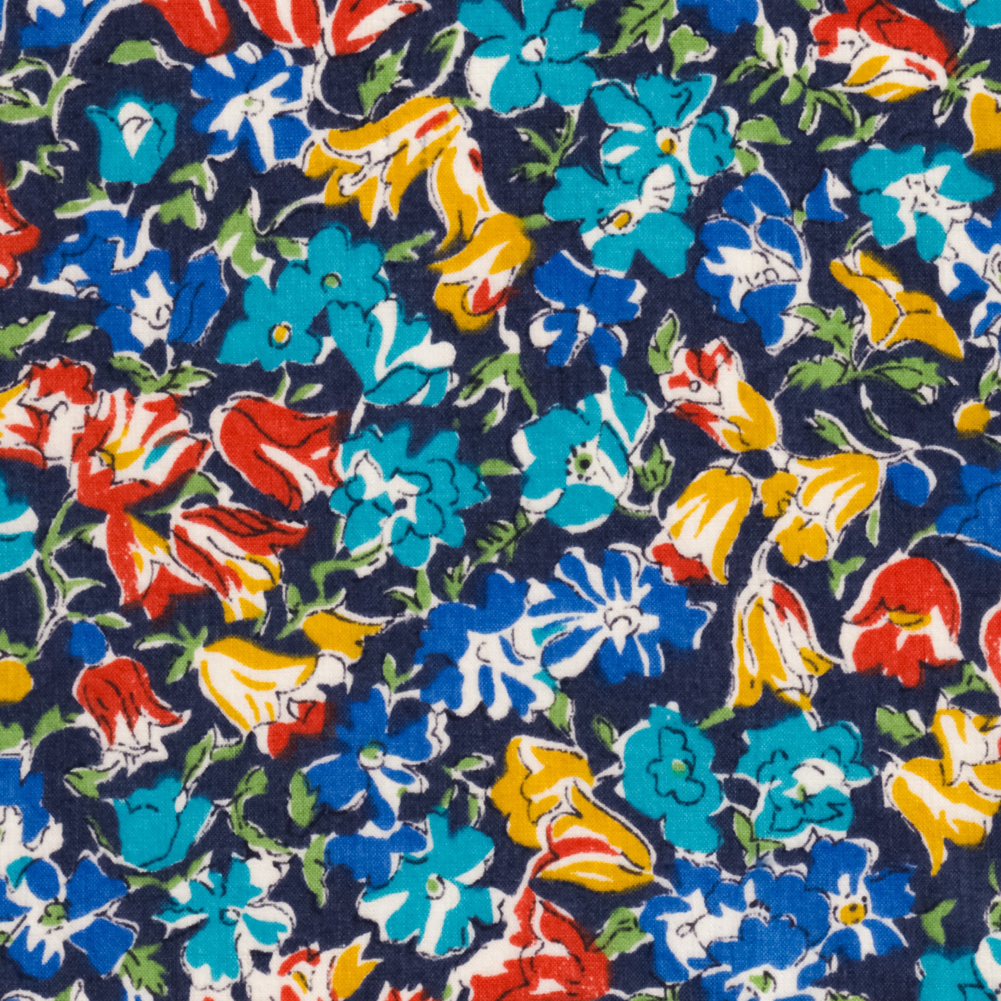 An old unnamed Liberty floral print with rich blue, red, and mustard yellow flowers on a navy background. A lovely rare fabric for Liberty collectors!