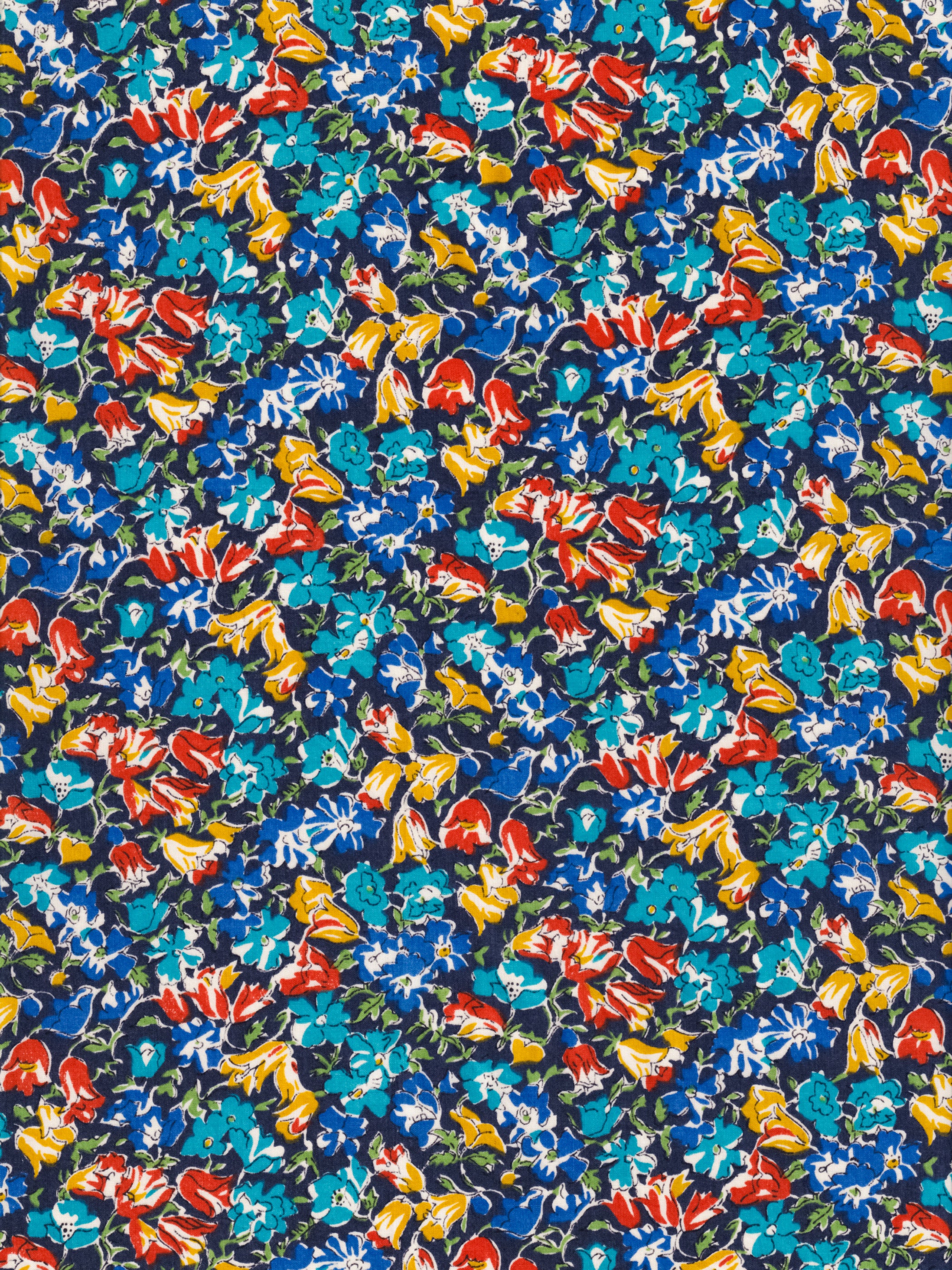An old unnamed Liberty floral print with rich blue, red, and mustard yellow flowers on a navy background. A lovely rare fabric for Liberty collectors!