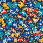 An old unnamed Liberty floral print with rich blue, red, and mustard yellow flowers on a navy background. A lovely rare fabric for Liberty collectors!