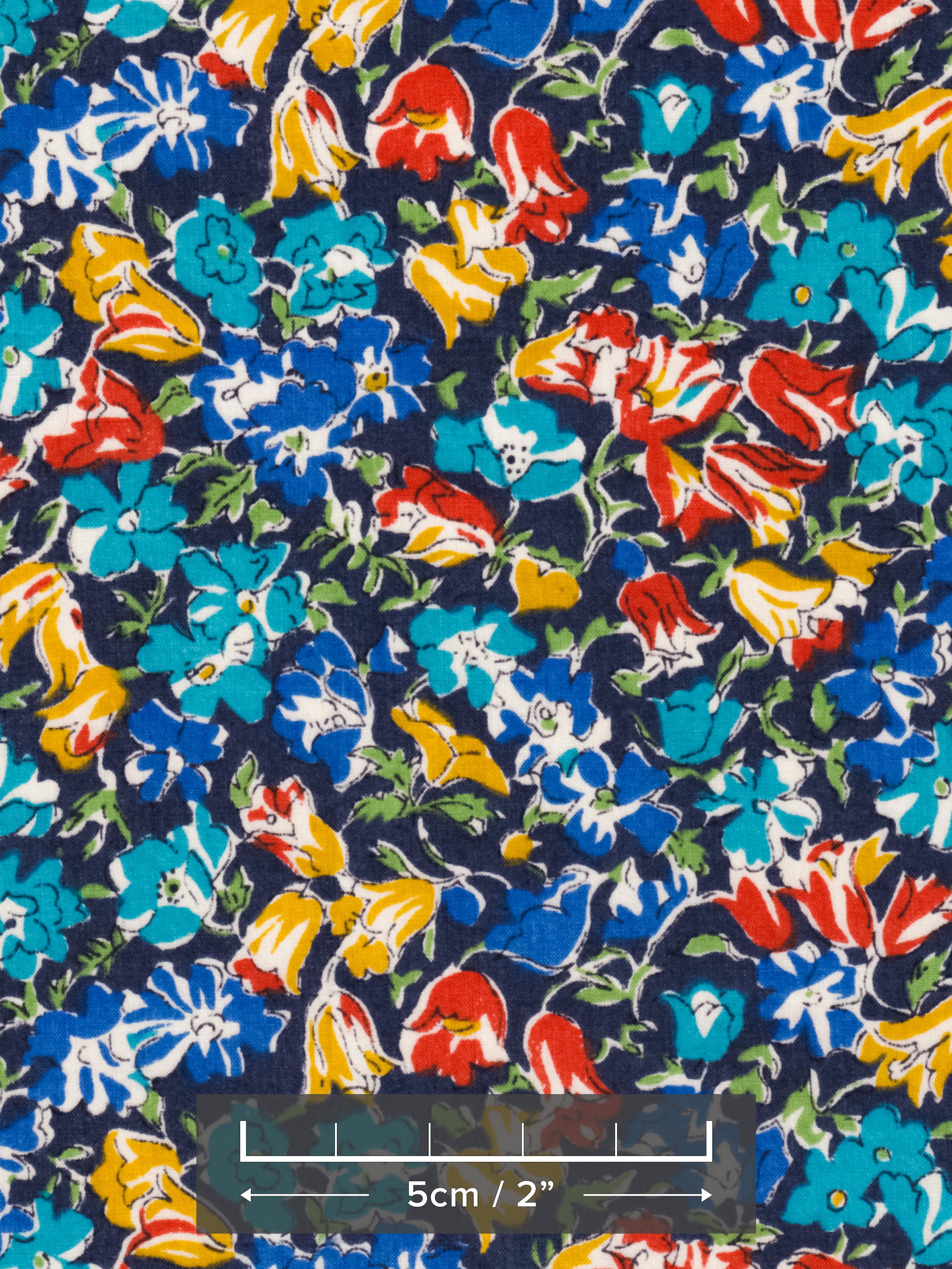 An old unnamed Liberty floral print with rich blue, red, and mustard yellow flowers on a navy background. A lovely rare fabric for Liberty collectors!
