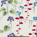 This is a stunning Liberty Japan unnamed vintage print from the early 2000s. The trailing floral has pops of blue, red, and green, on a cream background.