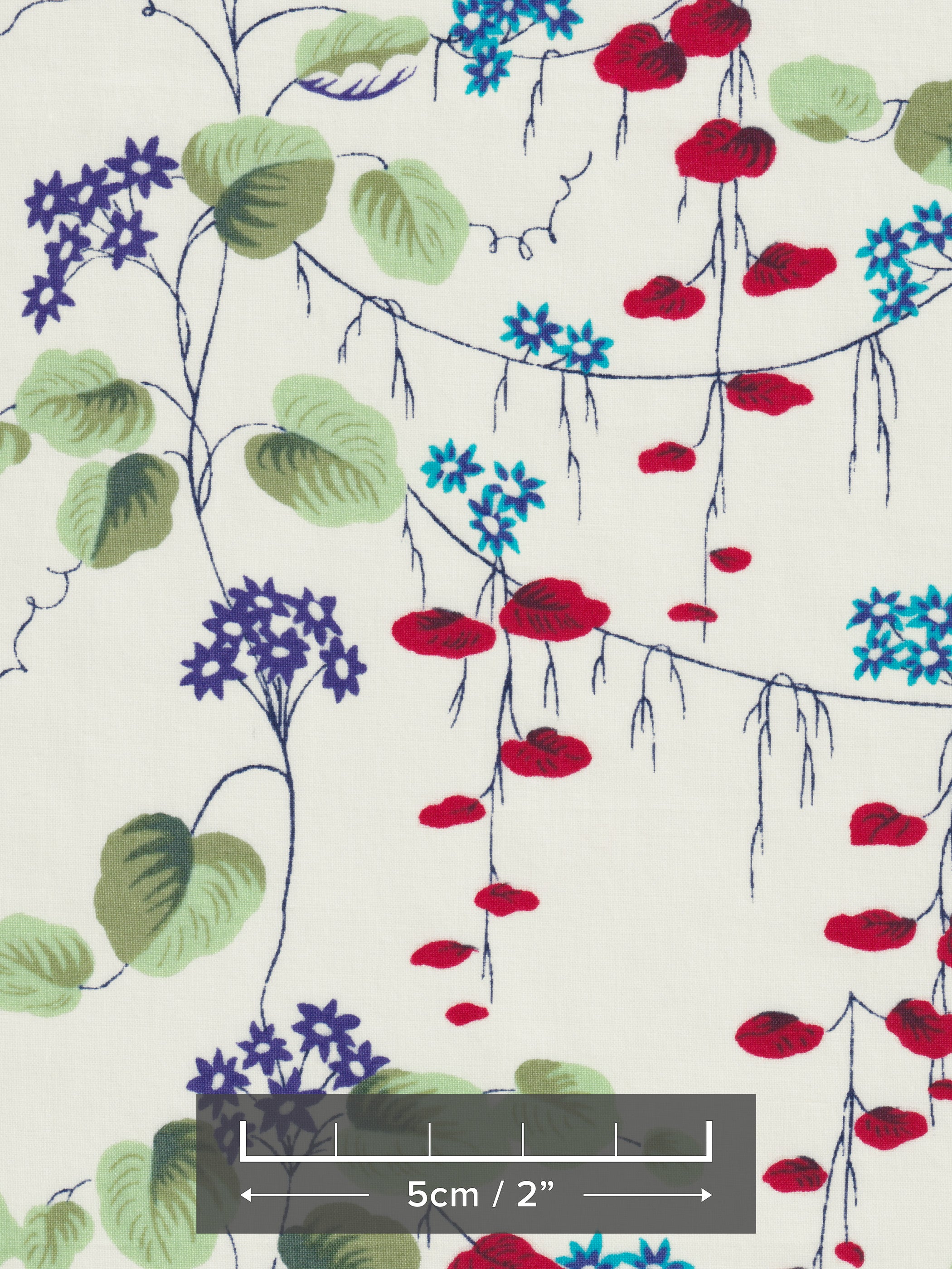 This is a stunning Liberty Japan unnamed vintage print from the early 2000s. The trailing floral has pops of blue, red, and green, on a cream background.