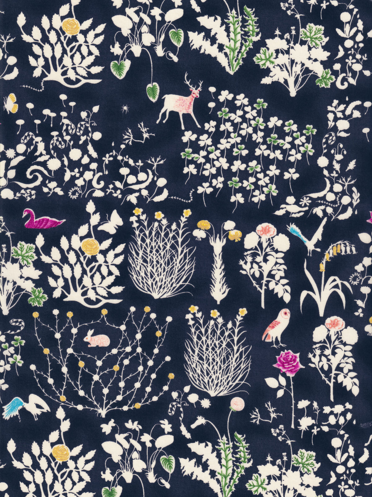 Yoshie is a novelty Liberty Japan print with cute woodland critters like stags, owls, and bunny rabbits. This print has metallic gold accents which are striking against the mottled navy background.
