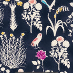 Yoshie is a novelty Liberty Japan print with cute woodland critters like stags, owls, and bunny rabbits. This print has metallic gold accents which are striking against the mottled navy background.