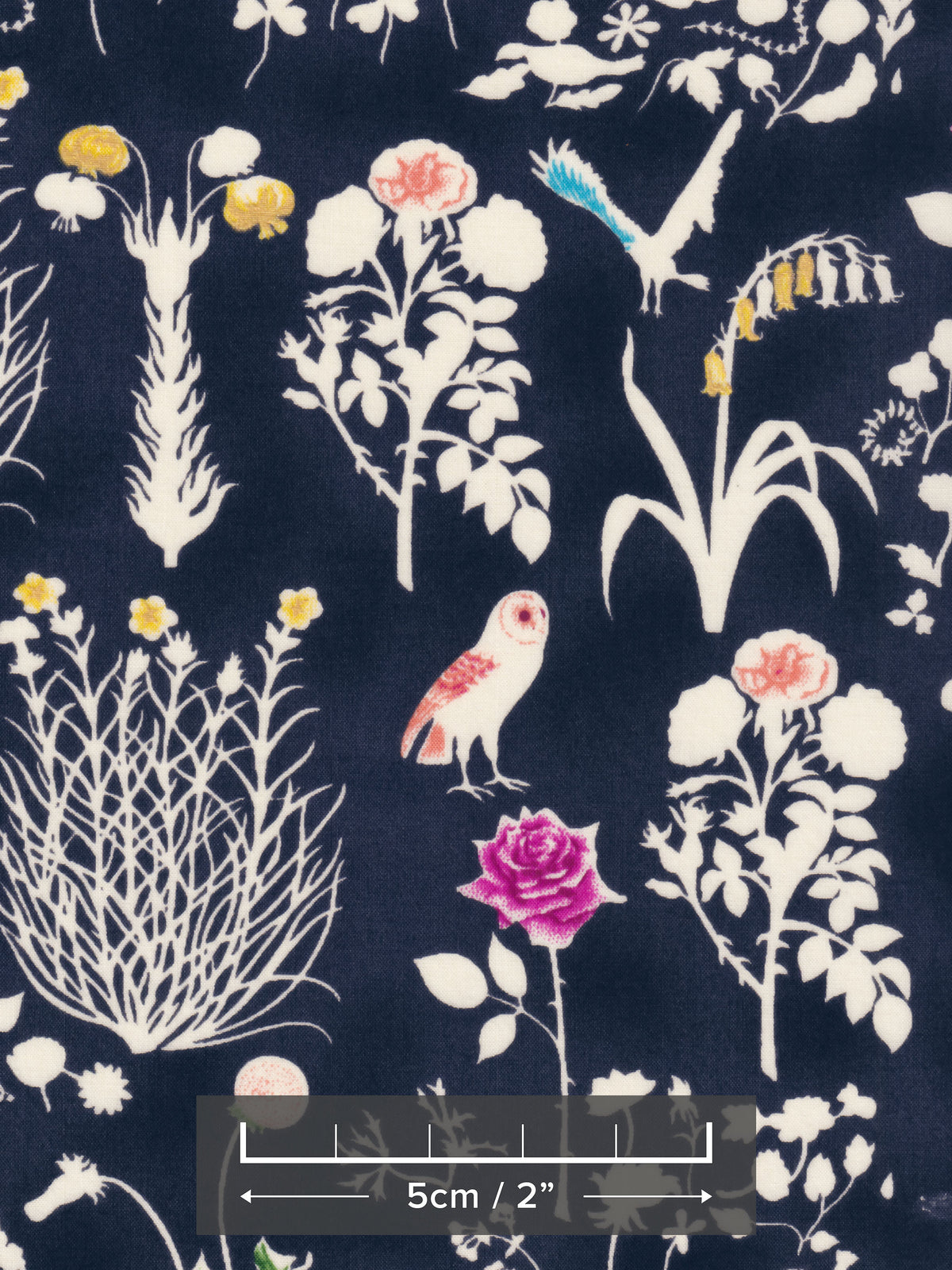 Yoshie is a novelty Liberty Japan print with cute woodland critters like stags, owls, and bunny rabbits. This print has metallic gold accents which are striking against the mottled navy background.
